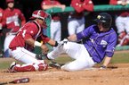 Arkansas catcher Jean Ramirez tries to tag out Western Illinois base runner Erik Maki during the fourth inning of Sunday afternoon's game at Baum Stadium in Fayetteville. Maki scored on the play. 