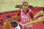 Arkansas' Dominique Wilson tries to get past the Missouri defenders in the second half of Sunday afternoon's game at Bud Walton Arena in Fayetteville.