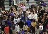 STAFF PHOTO ANDY SHUPE
Fayetteville coach Kyle Adams cuts the final strand of the net after the Bulldogs clinched the conference title with a win over Springdale Friday, Feb. 15, 2013, in Bulldog Gymnasium at Fayetteville High School.