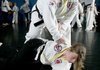 Jackson practices defense drills with black belt Savannah Barnes, 13, in class Tuesday morning at Northwest Taekwon-Do. 