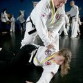Jackson practices defense drills with black belt Savannah Barnes, 13, in class Tuesday morning at No...