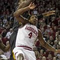 Missouri's Alex Oriakhi, top, attempts to rebound against Arkansas' Coty Clarke (4) during the secon...