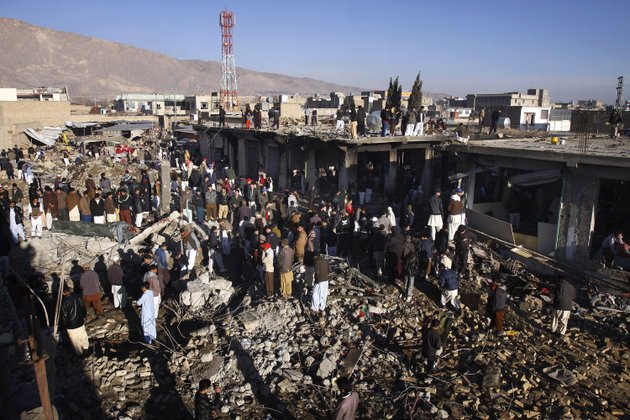 local-residents-survey-a-damaged-market-caused-by-saturdays-bombing-in-quetta-pakistan-on-sunday-feb-17-2013-the-death-toll-from-the-horrific-bombing-that-tore-through-the-crowded-vegetable-market-in-a-mostly-shiite-muslim-neighborhood-of-southwestern-pakistan-climbed-to-81-with-many-of-the-severely-wounded-dying-overnight-a-pakistani-police-official-said-sunday