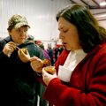 STAFF PHOTO JASON IVESTERSawyer Smith, 13, and his mother, Paula Smith, both of Garfield, sample ch...
