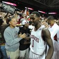 Arkansas junior guard Mardracus Wade (1) celebrates with the student section Saturday, Feb. 16, 2013...