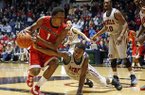 Mississippi guard Jarvis Summers (32) tries to steal the ball from Georgia guard Kentavious Caldwell-Pope (1) in the second half of their NCAA college basketball game in Oxford, Miss., Saturday, Feb. 16, 2013. Mississippi won 84-74. (AP Photo/Rogelio V. Solis)
