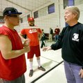 Josh Williams, left, playing for a team from Arkansas Support Network, talks Thursday with referee M...