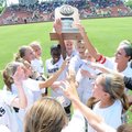 Bentonville celebrates with their Arkansas Activities Association trophy May 18 after defeating Conw...