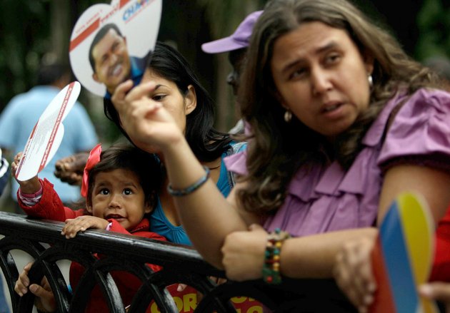 supporters-gather-in-bolivar-square-after-president-hugo-chavez-return-in-caracas-venezuela-monday-feb-18-2013-chavez-returned-to-venezuela-early-monday-after-more-than-two-months-of-medical-treatment-in-cuba-after-cancer-surgery-the-government-didnt-offer-an-explanation-as-to-why-chavez-made-his-surprise-return-while-he-is-undergoing-other-treatments-that-have-not-been-specified