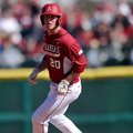 Arkansas' Matt Vinson rounds second base after advancing in the third inning of Sunday afternoon's g...