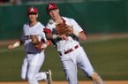 Arkansas third baseman Brian Anderson fields the ball as he makes a play for an out in the sixth inning of the first game in Tuesday afternoon's doubleheader against New Orleans at Baum Stadium in Fayetteville.