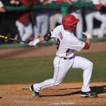Arkansas batter Tyler Spoon puts the ball into play during his at bat in the sixth inning of the fir...