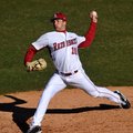 Arkansas freshman Colin Poche delivers a pitch during the Razorbacks' 14-0 win over New Orleans in t...