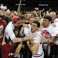 Arkansas junior guard Kikko Haydar celebrates with members of the student section Saturday, Feb. 16,...