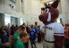 Sixth graders from Rose Bud Elementary gather around the Razorback mascot Tuesday afternoon during Razorback Day at the Capitol.