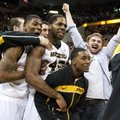 Missouri's Tony Criswell, left, Alex Oriakhi, center, and Corey Haith, bottom, right, celebrate afte...