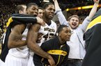 Missouri's Tony Criswell, left, Alex Oriakhi, center, and Corey Haith, bottom, right, celebrate after the Missouri defeated Florida 63-60 in an NCAA college basketball game Tuesday, Feb. 19, 2013, in Columbia, Mo. (AP Photo/L.G. Patterson)