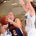 Ashley Ward, left, of Rogers Heritage looks to the basket under pressure from Rogers’ Samantha Warre...
