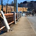 A pedestrian crosses the street near the Lafayette Street bridge Tuesday in Fayetteville. The Lafaye...