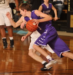 Elkins’ Dillon Gash drives past a West Fork defender during their Feb. 13 game in West Fork.