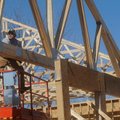 Jeff Millar, left, and Jason Jordon, both of Springdale set trusses in place Tuesday at the Casey’s ...