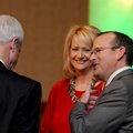 Mike Luttrell, right, talks Tuesday with wife Debbie Luttrell and Howard Hamilton, left, at the annu...