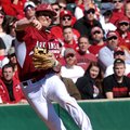 Arkansas infielder Willie Schwanke makes a play to throw out a Western Illinois runner in the second...