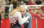Arkansas co-head coach Mark Cook speaks to senior Amy Borsellino before her performance on the bars during a meet with Georgia Friday, Jan. 11, 2013, in Barnhil Arena on the UA campus in Fayetteville.