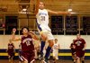 Andrew Harris, a Decatur senior forward, breaks away from Hartford’s Brody Funk and puts up a shot during play on Friday night at Decatur. 