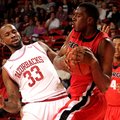 Arkansas junior Marshawn Powell (33) reacts after Georgia senior John Florveus (32) elbows Powell in...