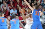 Arkansas' Coty Clarke is surrounded by Florida's defense in the first half of the game Tuesday, Feb. 5, 2013, at Bud Walton Arena in Fayetteville. The Razorbacks upset the Gators, winning 80-69.