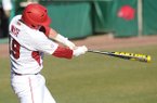 Arkansas junior Jake Wise connects for a two-run home run Friday, Feb. 22, 2013, during the second inning of play against Evansville at Baum Stadium in Fayetteville.