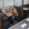 Robert Carter, left, and Chris Stecklein eat lunch Thursday at Flaps Down Grill inside the Springdal...