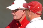 John McDonnell (left) spent 30 years as Arkansas' track & field and cross country coach.