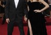 What are they wearing? A-listers Brad Pitt and Angelina Jolie pose before the 2012 Oscars. Jolie’s bared leg caused the biggest buzz on the red carpet last year. 