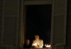 Pope Benedict XVI, seen here lighting a candle at his window overlooking St. Peter’s Square, is leaving the papacy on Thursday. 