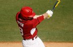 Arkansas' Tyler Spoon follows through on an at-bat against Evansville on Saturday, Feb. 23, 2013, at Baum Stadium in Fayetteville. 