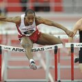 Arkansas senior Caleb Cross clears the final hurdle on his way to a second-place finish ahead of Mis...