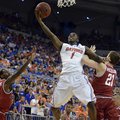 Florida guard Kenny Boynton (1) goes to the basket as Arkansas guard Mardracus Wade (1) and forward ...