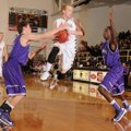 Bentonville’s Austin Haggard, center, looks to pass the ball while being pressured by Fayetteville’s...