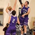 Tyler McCullough of Fayetteville blocks a shot by Bentonville’s Austin Haggard during Friday’s game ...