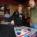 Kim Bowman-Billings, left, points Friday to a picture of a ship her father, right, Gerald Bowman, se...