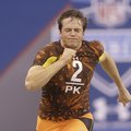 Arkansas punter Dylan Breeding goes through a drill during the NFL Combine in Indianapolis Saturday,...