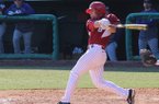 Tyler Spoon hits a grand slam home run during the eighth inning of a game against Evansville on Saturday, Feb. 23, 2013 at Baum Stadium in Fayetteville. 
