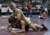 Bentonville’s Jeff Bizzle (top) defeated Justin Arnall of Little Rock Central to win the 132-pound state title Saturday at the Jack Stephens Center in Little Rock. Bentonville won the Class 6A-7A team title.