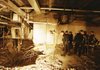 FILE - In this file photo of Feb. 27, 1993, police and firefighters inspect the bomb creater inside an underground parking garage of New York's World Trade Center the day after an explosion tore through it. Twenty years ago next week, a group of terrorists blew up explosives under one of the towers, killing six people and ushering in an era of terrorism on American soil.(AP Photo/Richard Drew, File)