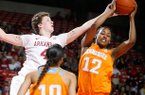 Arkansas senior Sarah Watkins and Tennessee freshman Bashaara Graves vie for a rebound during the second half on Sunday, Feb. 24, 2013, at Bud Walton Arena in Fayetteville.
