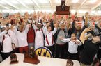Arkansas athletes celebrate after the men's and women's teams won conference titles Sunday, Feb. 24, 2013, during the Southeastern Conference Indoor Track and Field Championships at the Randal Tyson Track Center in Fayetteville.