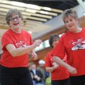 Judy Bailey, left, and Paula Fettig, both members of the Hoot ’N Holler Cloggers, a dance group base...