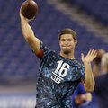 Arkansas quarterback Tyler Wilson runs a drill at the NFL football scouting combine in Indianapolis,...